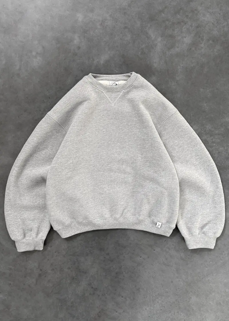 Akimbo Crewneck Heather Grey Front Akimbo Crewneck Heather Grey front view with classic crewneck design