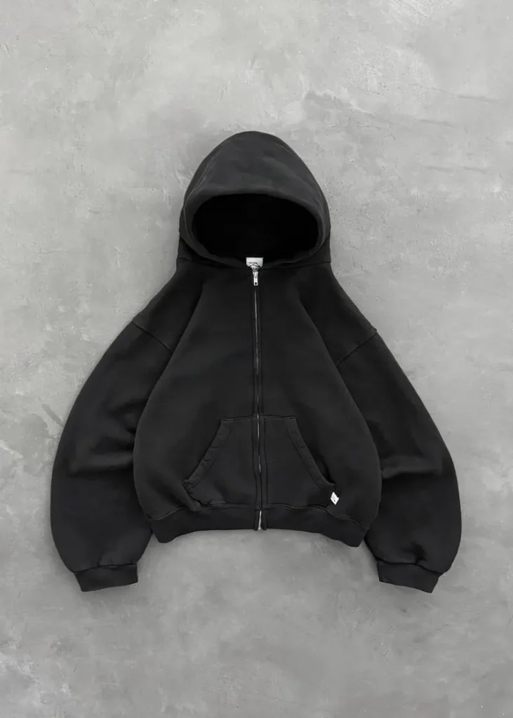 Akimbo Club Zip Up Black front view featuring a heavyweight black zip up hoodie with a relaxed fit