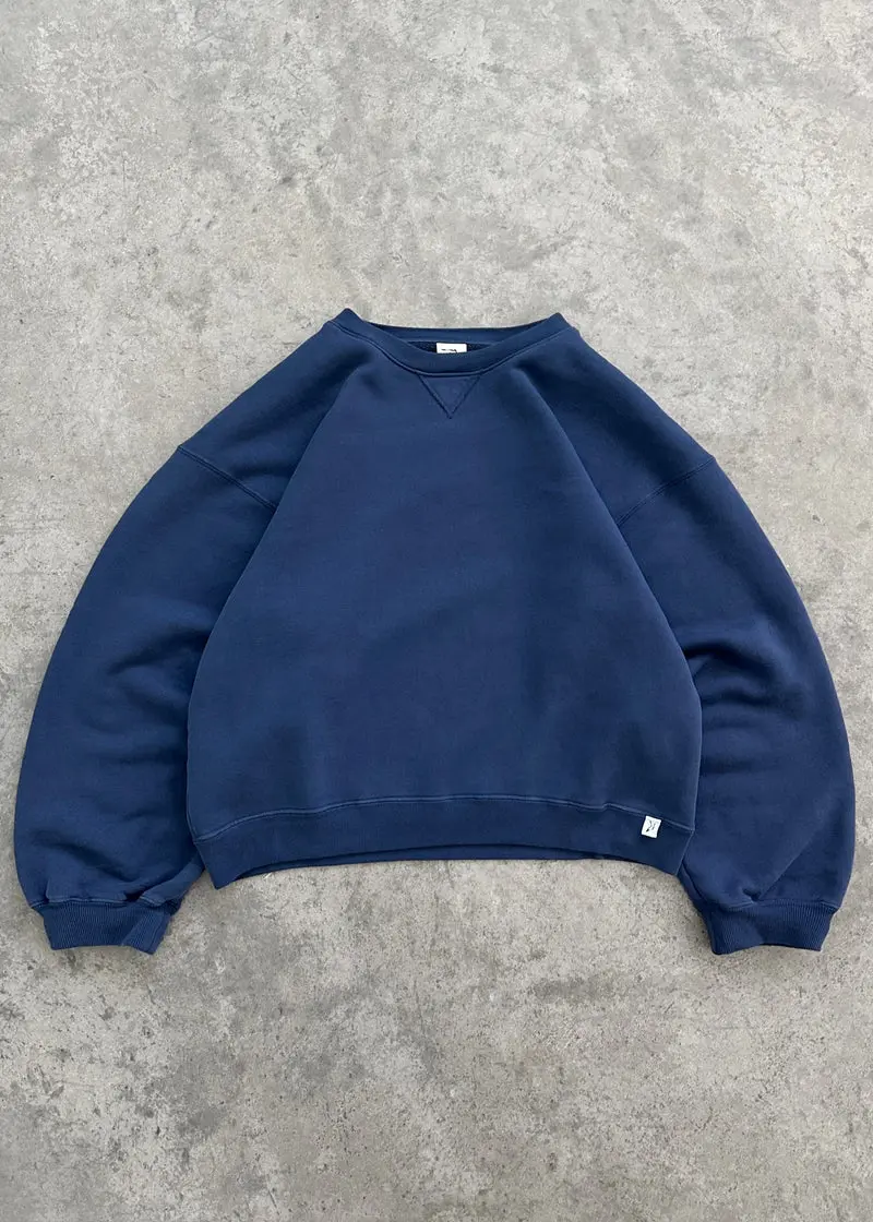 Akimbo Crewneck Navy Front Akimbo Crewneck Navy front view with simple crewneck design